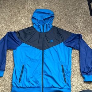 Nike Windrunner Blue Worn twice small hole on back Tags are just taken off!